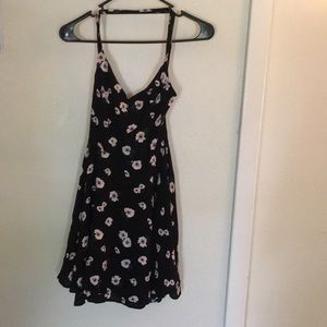 Black floral dress with adjustable straps.